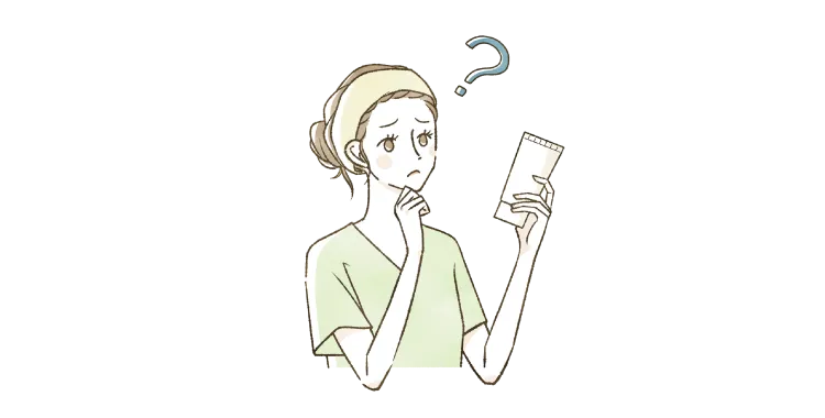 スキンケア商品を持って困惑している女性